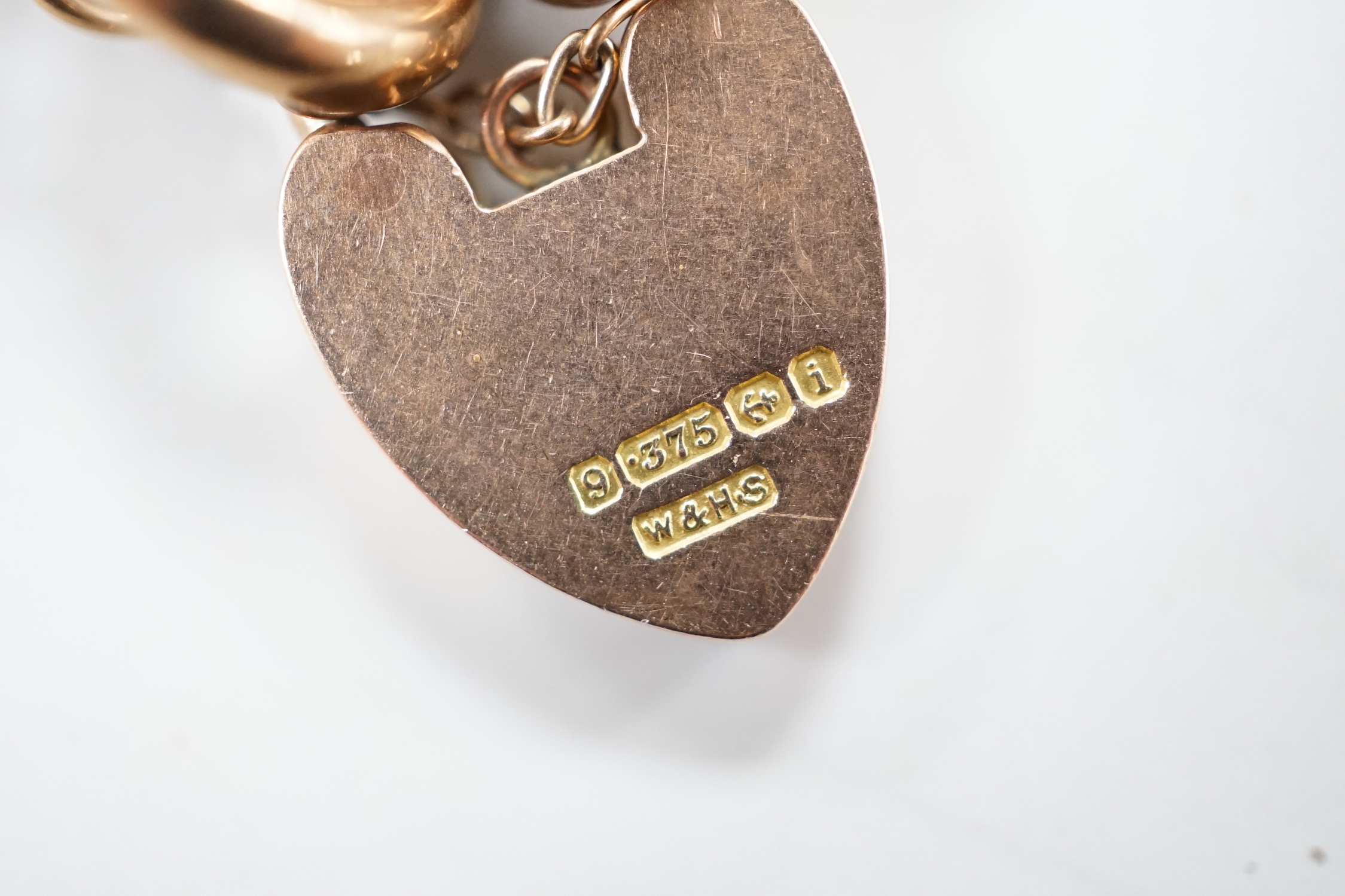 An Edwardian 9ct gold curb link bracelet, with heart shaped padlock clasp, 19cm, 16.2 grams.